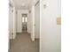 Bright hallway with multiple entryways and fresh white paint offers ample room to move around at 12780 N 57Th St, Tampa, FL 33617