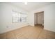 Bright living room with tile floors, white walls, large window, crown molding and entryway to the stairs at 12780 N 57Th St, Tampa, FL 33617