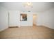 Open living area with tile flooring, white walls, ceiling fan and natural light at 12780 N 57Th St, Tampa, FL 33617