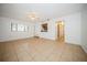 Spacious living room featuring tile floors and a ceiling fan with ample room for furniture at 12780 N 57Th St, Tampa, FL 33617