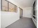 Enclosed patio with natural light and a back entrance provides a versatile outdoor space at 12780 N 57Th St, Tampa, FL 33617