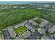 An aerial view shows lush greenery with nearby apartments and a pool, creating a serene and inviting community atmosphere at 13125 Wilcox Rd # 16202, Largo, FL 33774