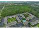 An aerial view shows lush greenery with nearby apartments and a pool, creating a serene and inviting community atmosphere at 13125 Wilcox Rd # 16202, Largo, FL 33774