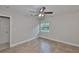 Bedroom with a ceiling fan, tile flooring, and natural light streaming through the window at 13125 Wilcox Rd # 16202, Largo, FL 33774