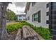 This two-story exterior has black shutters and a charming picnic area at 13125 Wilcox Rd # 16202, Largo, FL 33774