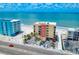 Exterior of the building showcasing its proximity to the beach, parking, and surrounding street at 14146 Gulf Blvd # 4B, Madeira Beach, FL 33708