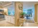 Inviting entryway with tile flooring, leading to the kitchen and dining area at 14146 Gulf Blvd # 4B, Madeira Beach, FL 33708