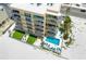 Beachfront condo community with a community pool and balconies with ocean views at 14146 Gulf Blvd # 4B, Madeira Beach, FL 33708