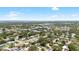 Wide aerial view showcasing the neighborhood and surrounding landscape at 1530 Picardy Cir, Clearwater, FL 33755