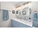 Stylish bathroom featuring a double vanity with modern fixtures, providing a functional and appealing space at 1530 Picardy Cir, Clearwater, FL 33755