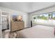 Serene main bedroom with large windows, ample closet space, and en-suite bathroom for comfortable living at 1530 Picardy Cir, Clearwater, FL 33755