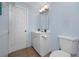 A full bathroom features a single sink vanity and a toilet at 1573 Cumberland Ln, Clearwater, FL 33755