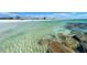 A beautiful beach with clear water and rocks, perfect for a relaxing day at 1573 Cumberland Ln, Clearwater, FL 33755