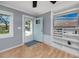 Inviting entryway with a blue door, built-in shelving and light gray walls at 1573 Cumberland Ln, Clearwater, FL 33755