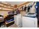 Laundry room with washer, dryer, shelving and storage at 1573 Cumberland Ln, Clearwater, FL 33755