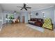 Spacious living room featuring wood floors, neutral paint, and dining area at 1573 Cumberland Ln, Clearwater, FL 33755