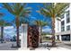 Modern Coachman Park entrance with palm trees, offering a vibrant community space in Clearwater at 1573 Cumberland Ln, Clearwater, FL 33755