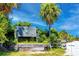 Entrance to Honeymoon Island State Park with lush greenery and a welcoming sign at 1573 Cumberland Ln, Clearwater, FL 33755