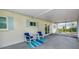 The covered patio offers a cozy seating area at 1573 Cumberland Ln, Clearwater, FL 33755