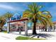 Entrance to Pier 60 with palm trees and sunny skies, inviting visitors to explore the attractions at 1573 Cumberland Ln, Clearwater, FL 33755