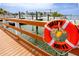 A waterfront view in Dunedin showcases a marina with boats and a life preserver with 'Dunedin Marina' on it at 1573 Cumberland Ln, Clearwater, FL 33755