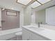An updated bathroom features a shower-tub combo, and neutral tile at 16014 Amberly Dr, Tampa, FL 33647