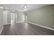 Spacious bedroom featuring laminate flooring, neutral walls, and large window at 16014 Amberly Dr, Tampa, FL 33647