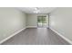 Bedroom with sliding glass doors, hardwood flooring, and natural light at 16014 Amberly Dr, Tampa, FL 33647