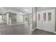 Bright living room boasts hardwood floors, a large mirror wall, and decorative glass paneled doors at 16014 Amberly Dr, Tampa, FL 33647
