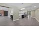 Spacious living area featuring a fireplace and an updated kitchen view at 16014 Amberly Dr, Tampa, FL 33647