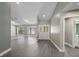 Bright living room boasts hardwood floors, a large mirror wall, and decorative glass paneled doors at 16014 Amberly Dr, Tampa, FL 33647