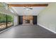 The living room offers a brick fireplace, vaulted ceilings, and natural light at 16014 Amberly Dr, Tampa, FL 33647
