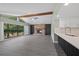 An open living room with a fireplace and expansive windows offers ample natural light at 16014 Amberly Dr, Tampa, FL 33647
