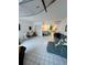 Open concept living space with surfboard ceiling decor and a combined dining and kitchen area at 16400 Gulf Blvd # 307, North Redington Beach, FL 33708