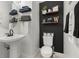 Stylish half bathroom with modern fixtures and decorative shelving at 1844 Odiorne Point Ln, Wesley Chapel, FL 33543