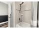 Tiled bathroom features a shower and bath, and updated fixtures at 1844 Odiorne Point Ln, Wesley Chapel, FL 33543