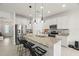 Modern kitchen with stainless steel appliances and a granite island at 1844 Odiorne Point Ln, Wesley Chapel, FL 33543