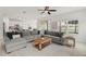 Spacious living room featuring a plush sectional sofa and bright natural light at 1844 Odiorne Point Ln, Wesley Chapel, FL 33543