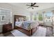 Inviting primary bedroom with ample natural light, hardwood floors, and a cozy atmosphere at 1844 Odiorne Point Ln, Wesley Chapel, FL 33543