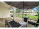 Outdoor patio area offers a comfortable place to relax with views of the private backyard at 1844 Odiorne Point Ln, Wesley Chapel, FL 33543