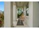 Inviting front porch featuring comfortable seating and stylish decor at 1844 Odiorne Point Ln, Wesley Chapel, FL 33543