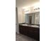 Bathroom with dual sinks, vanity and granite countertops at 2216 4Th Sw St, Ruskin, FL 33570
