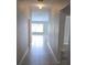 Inviting entryway featuring tile flooring and views of the living area with natural light at 2216 4Th Sw St, Ruskin, FL 33570
