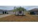 Charming single-story home featuring an attached two-car garage and well-maintained landscaping at 2216 4Th Sw St, Ruskin, FL 33570