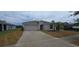 Charming single-story home featuring an attached two-car garage and well-maintained landscaping at 2216 4Th Sw St, Ruskin, FL 33570
