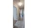 Bright hallway featuring tile flooring, neutral walls, and doorways leading to other rooms at 2216 4Th Sw St, Ruskin, FL 33570