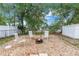A stone fire pit and seating provides a relaxing place to enjoy the spacious backyard at 2270 Amherst Ave, Spring Hill, FL 34609