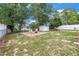 Backyard with grass, shed, and privacy fence at 2270 Amherst Ave, Spring Hill, FL 34609
