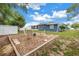 Backyard with chairs on a stone area at 2270 Amherst Ave, Spring Hill, FL 34609