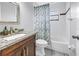Bathroom featuring granite vanity, shower, and tile floors at 2270 Amherst Ave, Spring Hill, FL 34609